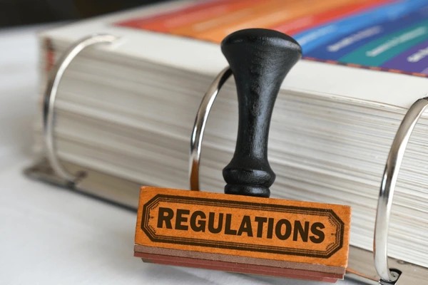 The word "Regulation" next to a book of regulations