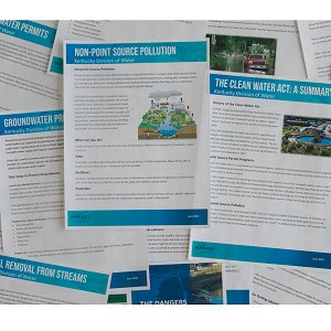 DOW fact sheets scattered on a table top.