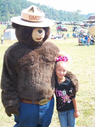 Smokey Bear and a young person