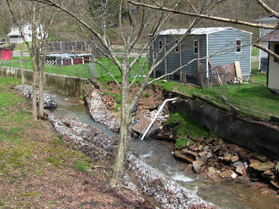 Stream collapsed behind house